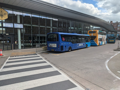 A blue bus branded DIAMOND just behind a Stagecoach bus